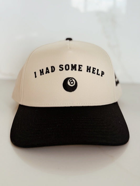 Beige and black cap with text on a white background